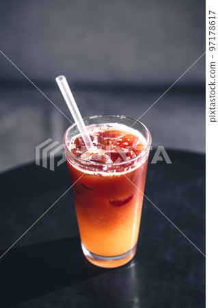 Cold summer coffee drink with ice and orange juice. Cold summer coffee drink with ice and orange juice. 97178617