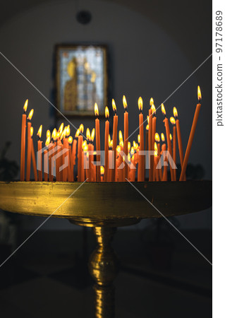 Close-up, candles in the temple on a blurred background. Close-up, candles in the temple on a blurred background. 97178689
