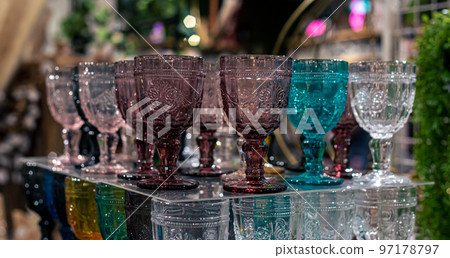 Multi-colored glass goblets in a shop window. 97178797
