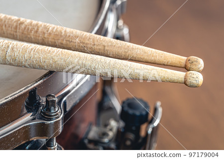 Close-up, drumsticks on a blurred background. Close-up, drumsticks on a blurred background. 97179004