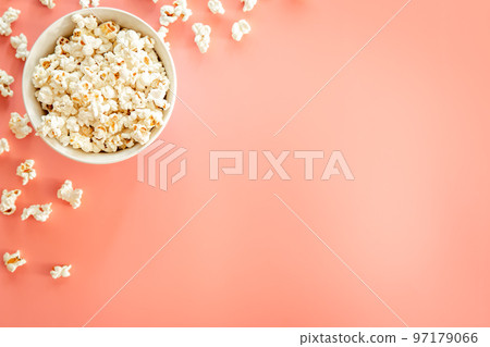 Popcorn plate on pink background, flat lay. Popcorn plate on pink background, flat lay. 97179066
