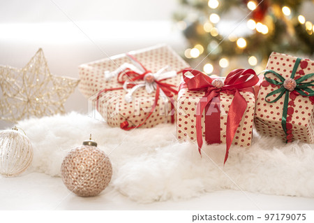 Christmas festive composition with three gift boxes on bokeh background close up. 97179075