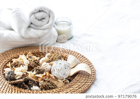 Spa composition with dried flowers, candles and towels. 97179076