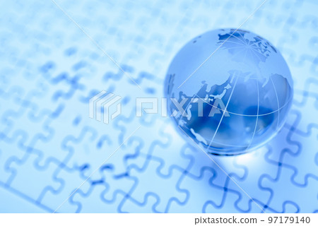 Globe on jigsaw puzzle last piece blue Globe on jigsaw puzzle last piece blue 97179140