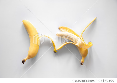 Two bananas on a white background isolated, conceptual minimalism. 97179399