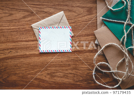 Vintage composition with envelopes on wooden background, flat lay. Vintage composition with envelopes on wooden background, flat lay. 97179435