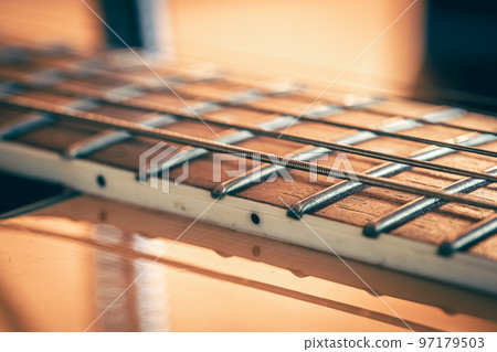 Strings on a classical acoustic guitar, macro shot. Strings on a classical acoustic guitar, macro shot. 97179503