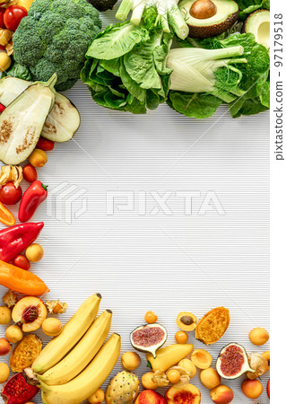 A variety of fresh vegetables and fruits on a white background, flat lay. 97179518