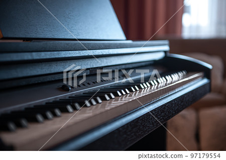 Close-up, keys of an electronic piano on a blurred background. 97179554