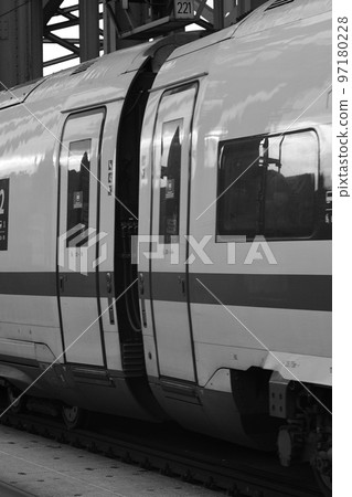 Grayscale closeup of the wagon and the door of a German express train in Cologne, Germany 97180228