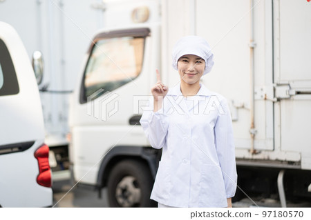 Young female food delivery driver (pointing pose) Young female food delivery driver (pointing pose) 97180570