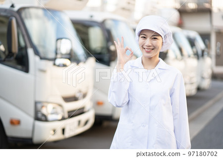 Young female food delivery driver (OK pose) 97180702