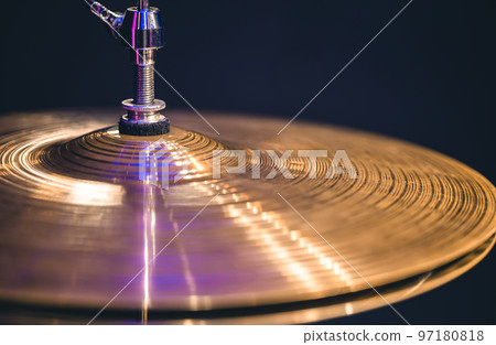 Hi-hat close-up of plates with drumsticks on a background of colored lanterns. Hi-hat close-up of plates with drumsticks on a background of colored lanterns. 97180818