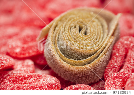 Red gummies jelly candies in sugar, background. 97180954