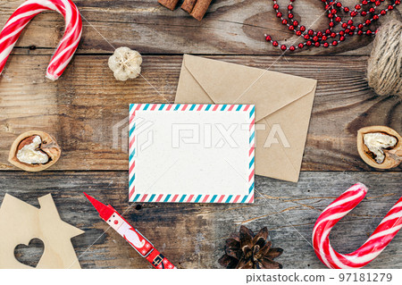 Blank paper, envelope and Christmas decor on wooden background, copy space. 97181279