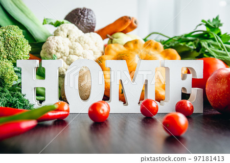 Composition with decorative word home and different vegetables. 97181413