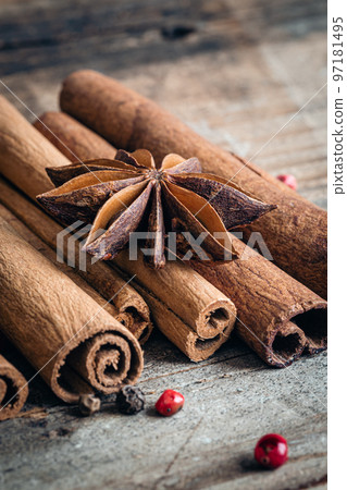 Close-up, star anise and cinnamon sticks on a wooden background, macro shot. 97181495