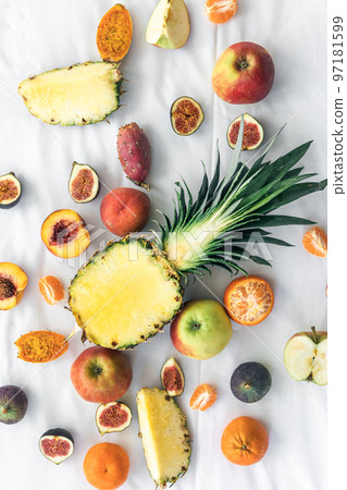 Fruit background with cut pineapple and other exotic fruits. Fruit background with cut pineapple and other exotic fruits. 97181599