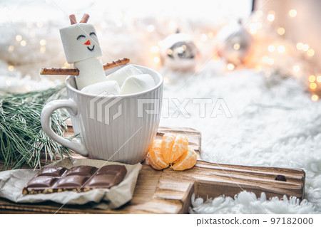 Christmas background with marshmallow snowman in a cup. Christmas background with marshmallow snowman in a cup. 97182000