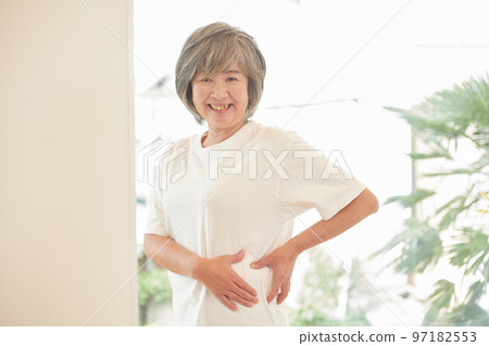 Senior woman who is worried about her waist 97182553