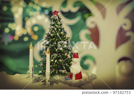 Vintage christmas background with fir tree candles and toy santa claus. Vintage christmas background with fir tree candles and toy santa claus. 97182753