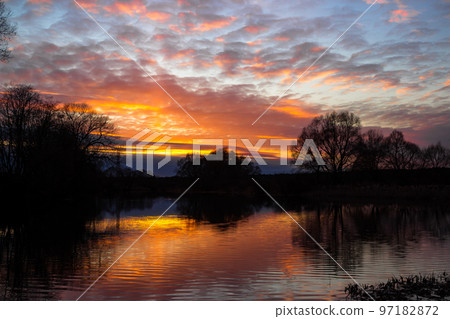 Colorful multicolor sunset over the river Colorful multicolor sunset over the river 97182872