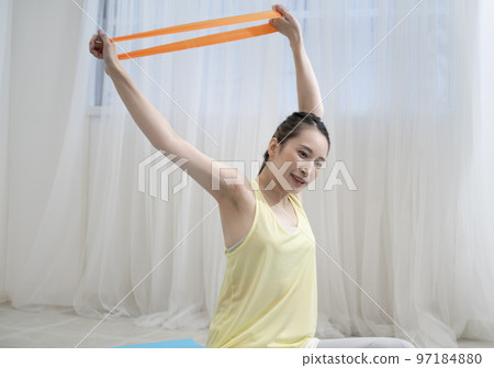 woman doing rubber band training 97184880