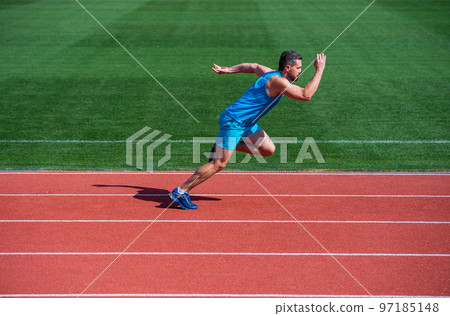 muscular athletic runner training. sport. male endurance and stamina. successful sportsman finishing. athlete runner do aerobic or anaerobic load. man start running on stadium. fitness gym outdoor 97185148