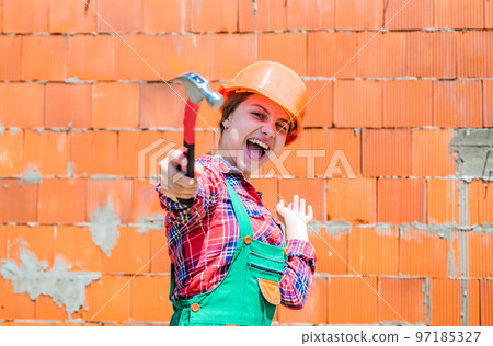 Foreman inspector love working. occupation learning concept. kid in workshop training to use hand instrument. girl wearing engineer clothes. Tools to improve yourself. engineering education Foreman inspector love working. occupation learning concept. kid in workshop training to use hand instrument. girl wearing engineer clothes. Tools to improve yourself. engineering education 97185327