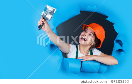 Concentrated on work. future engineer. happy kid use spatula repairing tool. building construction site. child architect worker. labor day concept. childhood development. teenager girl assistant Concentrated on work. future engineer. happy kid use spatula repairing tool. building construction site. child architect worker. labor day concept. childhood development. teenager girl assistant 97185333