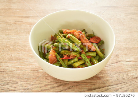 spicy stir fried slice yard long bean with fat pork in curry sauce on bowl 97186276