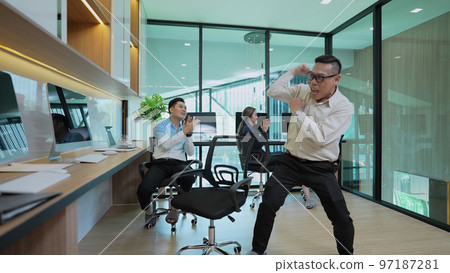 Business concept of 4k Resolution. Employees having fun dancing in the office. congratulations on success. 97187281