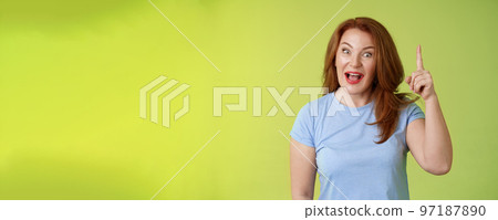 Got excellent idea solution up there. Excited smart creative middle-aged mature woman ginger hair raise index finger eureka pointing top explain offer terms smiling describe cool advertisement 97187890