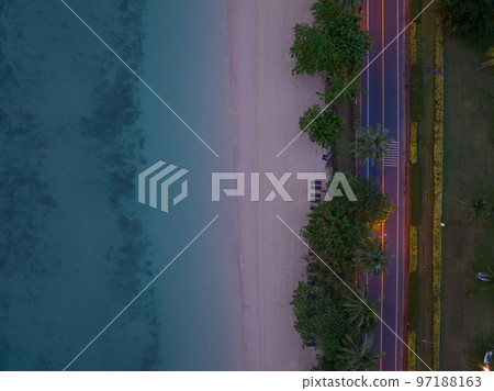 Aerial view sandy beach and waves Beautiful tropical sea in sunset time, Summer season image by Aerial view drone shot, high angle view Top down sea beach 97188163