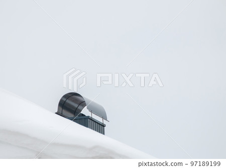 Smoke, metal exhaust pipe on the roof of a modern house. 97189199