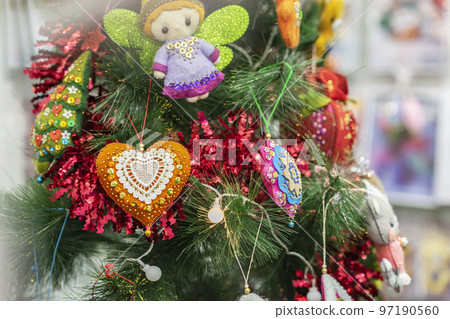 Christmas homemade toys, garland on Christmas tree. Abstract winter background 97190560