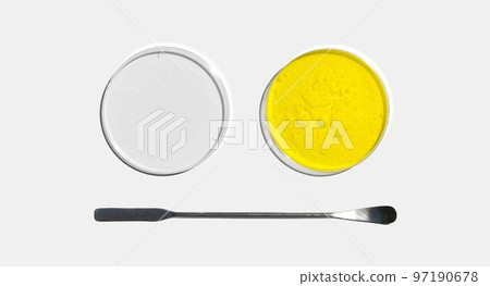 Potassium Chromate Powder in Petri dish with plastic lid placed next to the stainless spatula on laboratory table. Potassium Chromate Powder in Petri dish with plastic lid placed next to the stainless spatula on laboratory table. 97190678