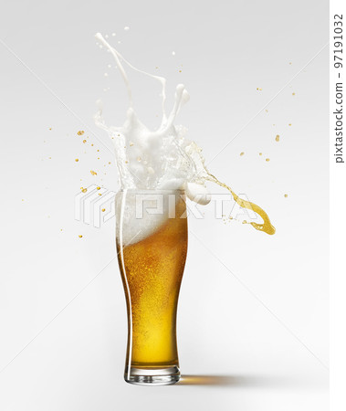 Foam splashes. Glass of delicious lager beer isolated over grey background. Beer drops. Concept of alcohol, oktoberfest, drinks 97191032