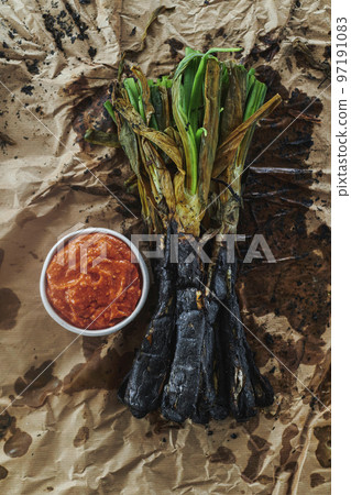 roasted calcots typical of Catalonia, Spain roasted calcots typical of Catalonia, Spain 97191083