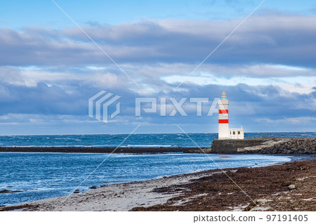 Lighthouse on the coast of Icelandic sea, Iceland Lighthouse on the coast of Icelandic sea, Iceland 97191405