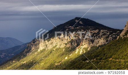 Mountain Landscape Background. Sunset Sky with Sunrays. Near Dorgali, Sardinia, Italy. 97192058