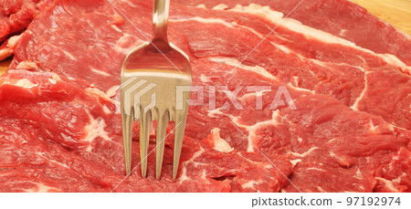 Clean very fresh red raw cow meat beef and fork, on cutting board Clean very fresh red raw cow meat beef and fork, on cutting board 97192974
