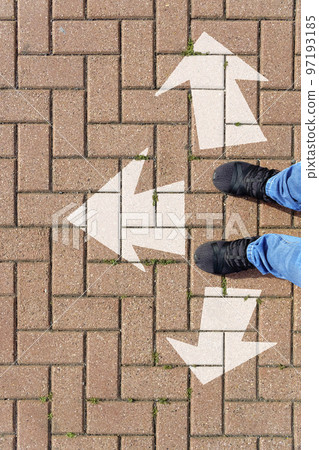 Selfie of feet and arrows on the road 97193185