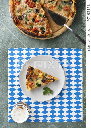 beer and pizza on white and blue tablecloth Oktoberfest 97193188