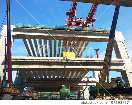 SELANGOR, MALAYSIA -JULY 6, 2022: An elevated road is under construction. Reinforced concrete is used for the structure. Construction is done in stages according to the sequence of works. SELANGOR, MALAYSIA -JULY 6, 2022: An elevated road is under construction. Reinforced concrete is used for the structure. Construction is done in stages according to the sequence of works. 97193727