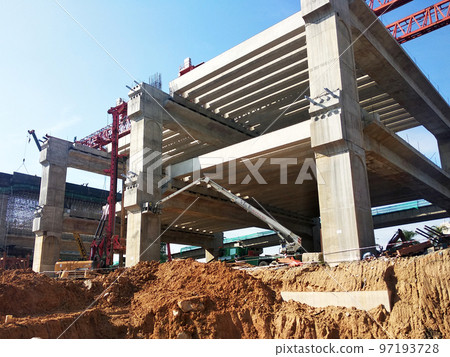 SELANGOR, MALAYSIA -JULY 6, 2022: An elevated road is under construction. Reinforced concrete is used for the structure. Construction is done in stages according to the sequence of works. SELANGOR, MALAYSIA -JULY 6, 2022: An elevated road is under construction. Reinforced concrete is used for the structure. Construction is done in stages according to the sequence of works. 97193728