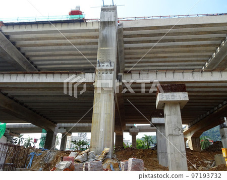 SELANGOR, MALAYSIA -JULY 6, 2022: An elevated road is under construction. Reinforced concrete is used for the structure. Construction is done in stages according to the sequence of works. SELANGOR, MALAYSIA -JULY 6, 2022: An elevated road is under construction. Reinforced concrete is used for the structure. Construction is done in stages according to the sequence of works. 97193732