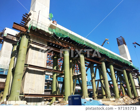 SELANGOR, MALAYSIA -JULY 6, 2022: An elevated road is under construction. Reinforced concrete is used for the structure. Construction is done in stages according to the sequence of works. SELANGOR, MALAYSIA -JULY 6, 2022: An elevated road is under construction. Reinforced concrete is used for the structure. Construction is done in stages according to the sequence of works. 97193733
