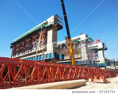 SELANGOR, MALAYSIA -JULY 6, 2022: An elevated road is under construction. Reinforced concrete is used for the structure. Construction is done in stages according to the sequence of works. SELANGOR, MALAYSIA -JULY 6, 2022: An elevated road is under construction. Reinforced concrete is used for the structure. Construction is done in stages according to the sequence of works. 97193734