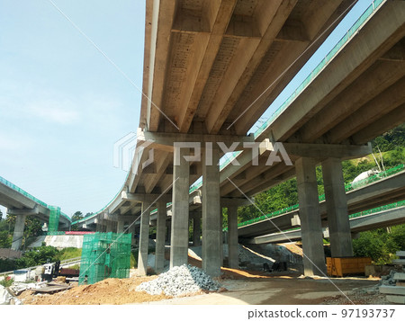 SELANGOR, MALAYSIA -JULY 6, 2022: An elevated road is under construction. Reinforced concrete is used for the structure. Construction is done in stages according to the sequence of works. SELANGOR, MALAYSIA -JULY 6, 2022: An elevated road is under construction. Reinforced concrete is used for the structure. Construction is done in stages according to the sequence of works. 97193737